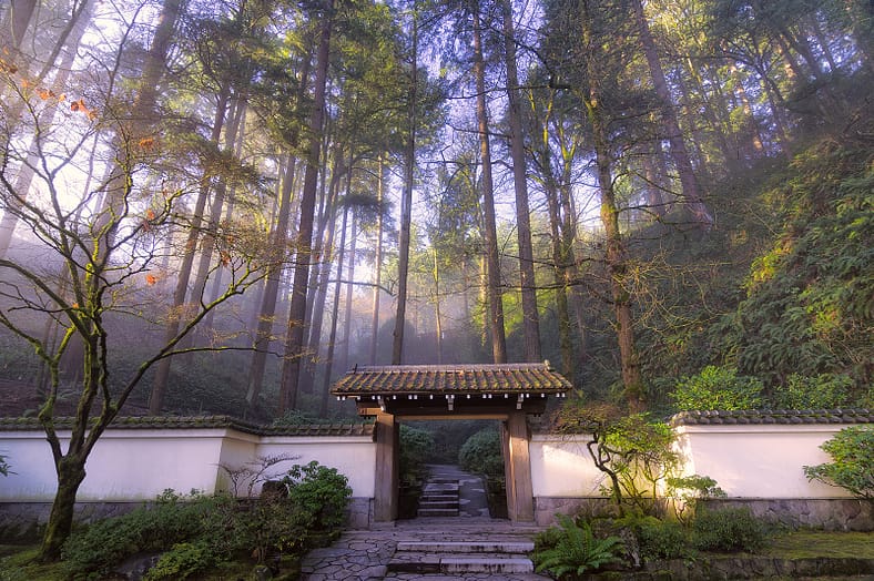 A nearly 200-year-old gate that people walk through to enter Portland Japanese Garden.